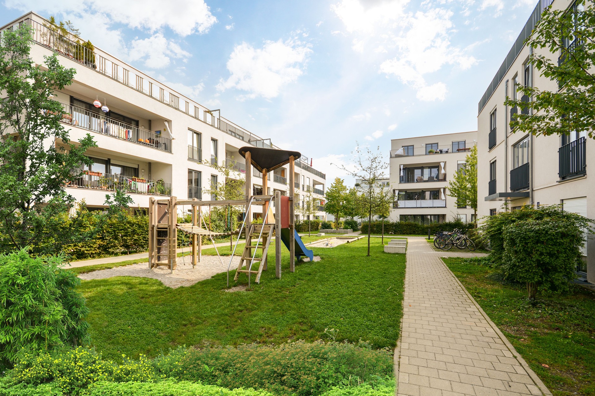 Cityscape of a residential area with modern apartment buildings, new green and sustainable urban landscape in the city for families