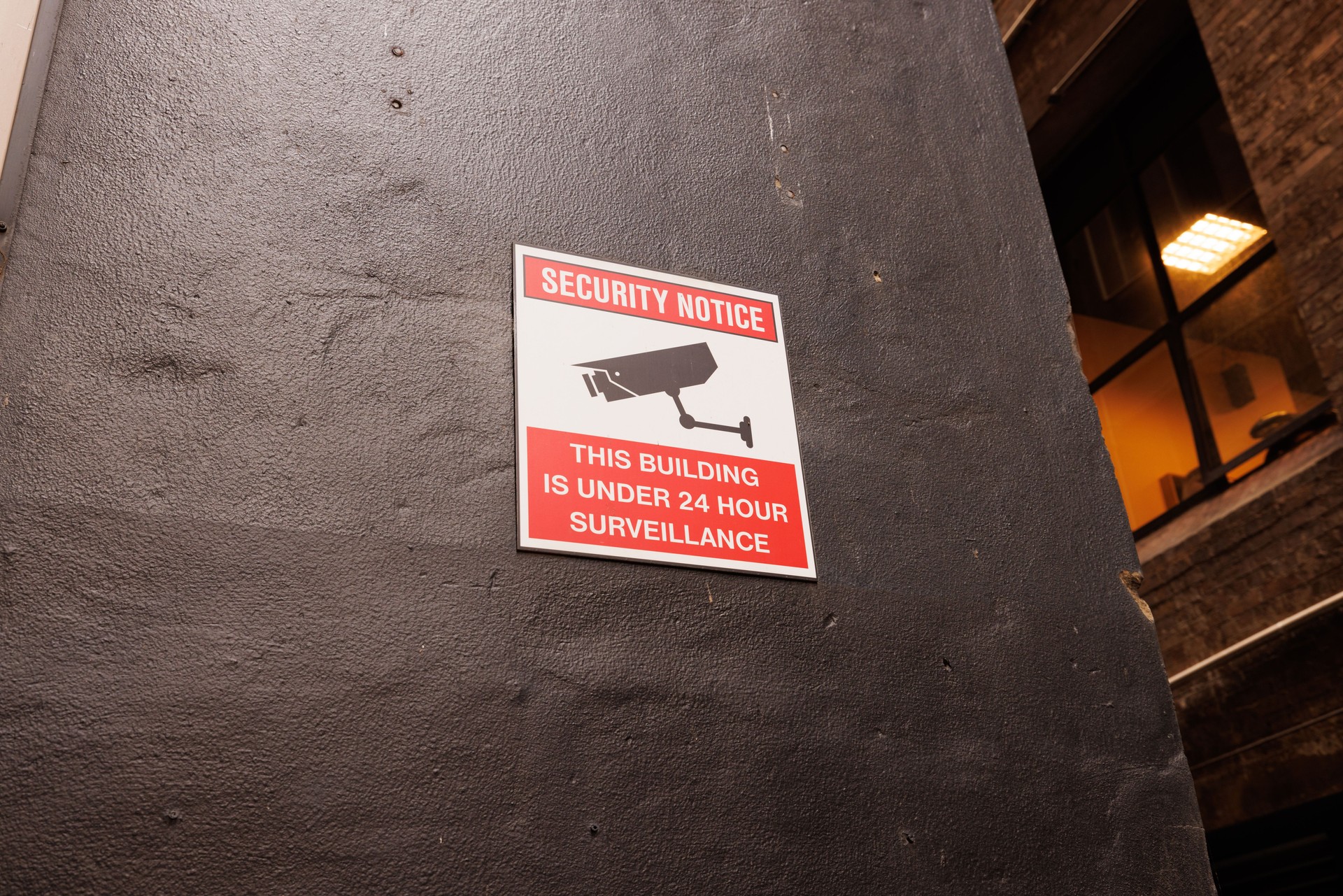 Security camera sign on a painted wall